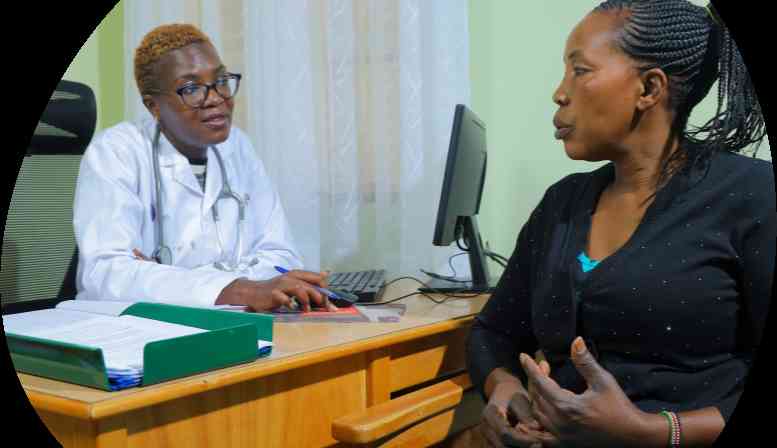 Healthcare worker consulting with a patient